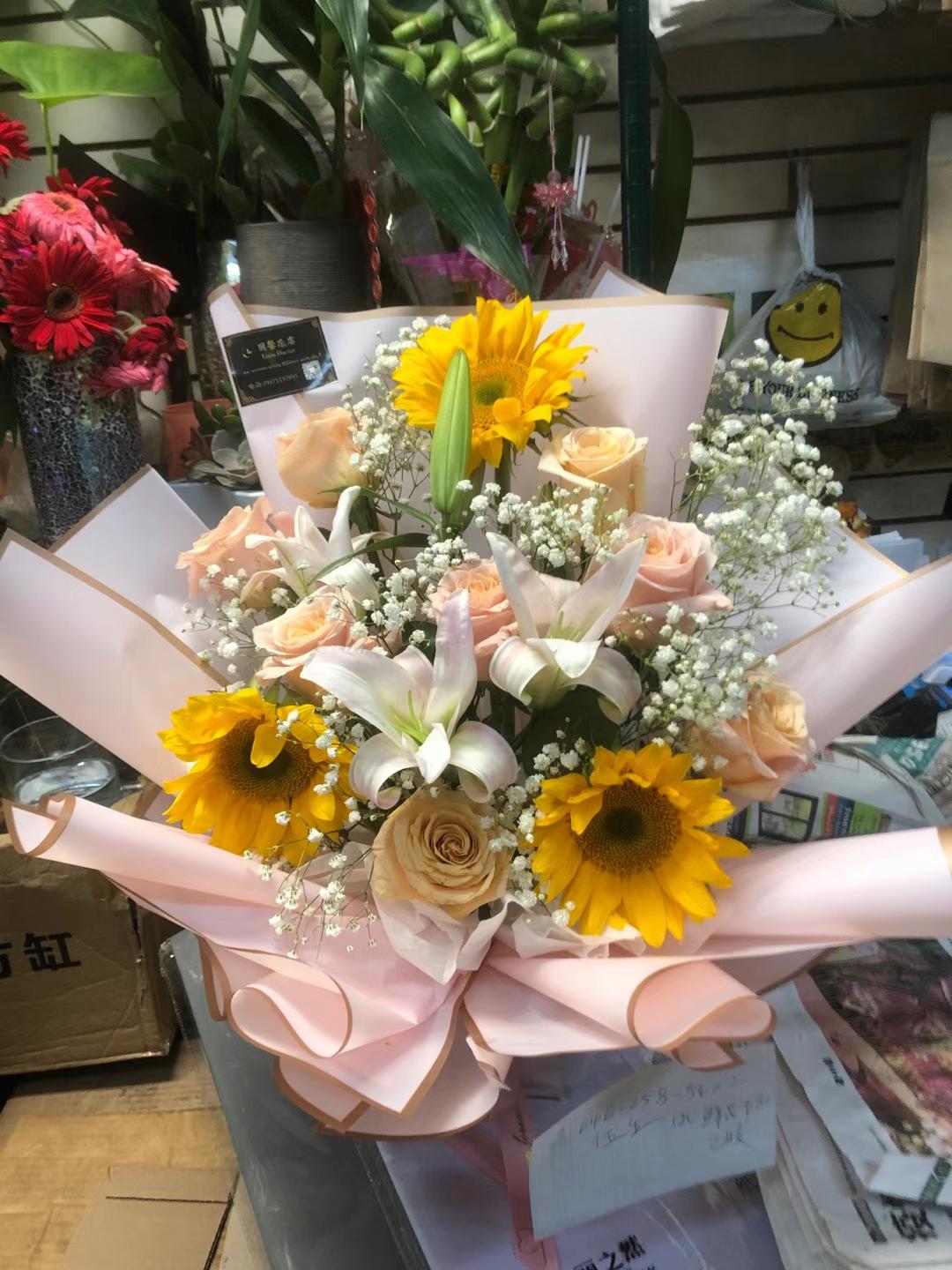 sunflowers and white lilies 88 SUNFLOWER, LILY, AND PEACH ROSE
